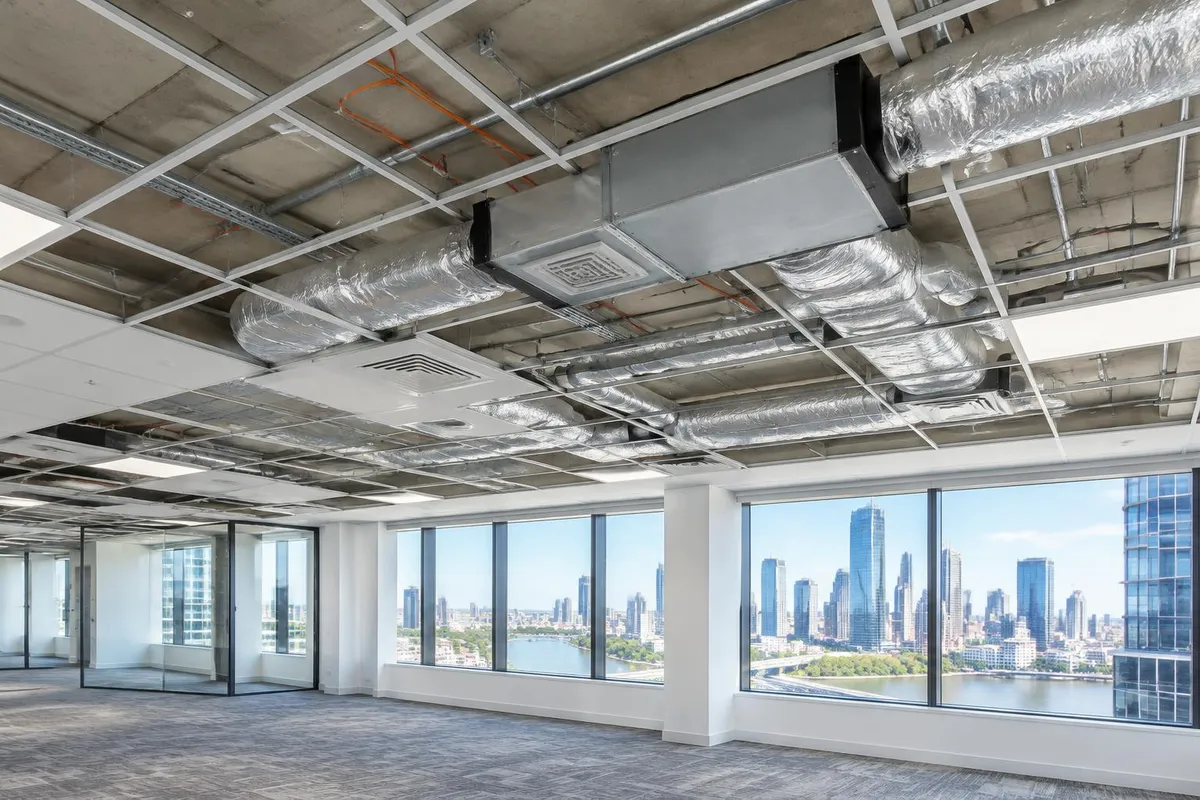 Commercial Air Conditioning Costs Brisbane Illustrative office fit-out with exposed ceiling ductwork and a concealed air conditioning unit