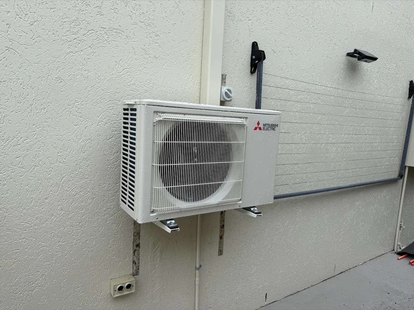 Wall-mounted split system air conditioner installed in a Brisbane bedroom by Hart Air