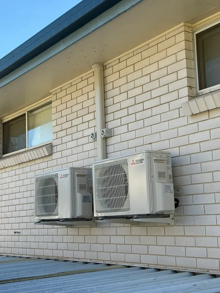 Outdoor condenser pair installed for a multi-head split system in Brisbane